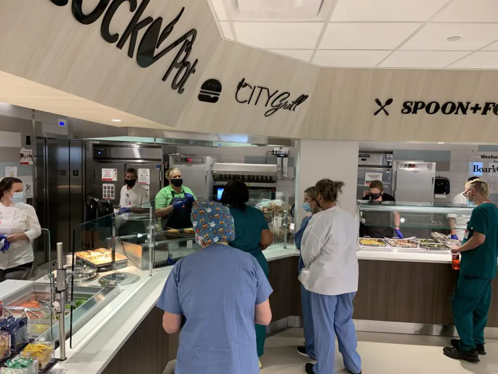 Health professionals in serving line