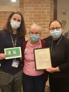 Three Females Smizing and Holding Certificates