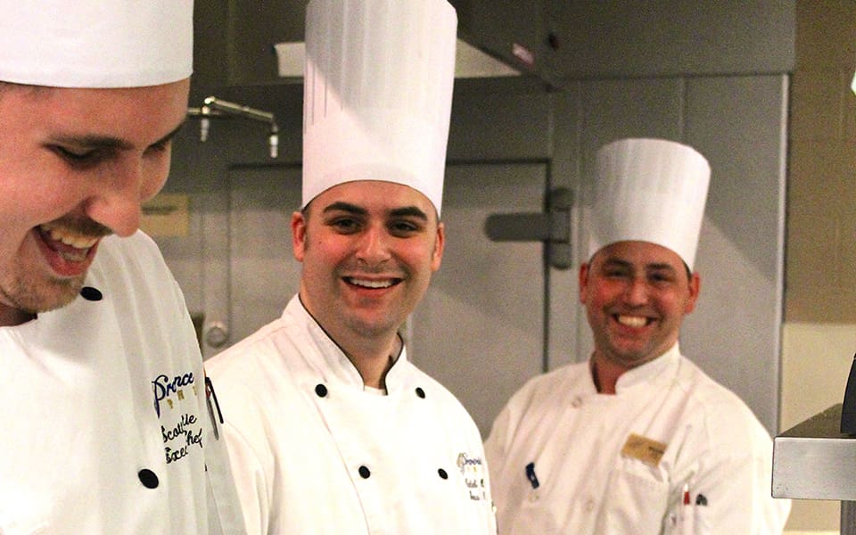 Three Male Chefs Smiling